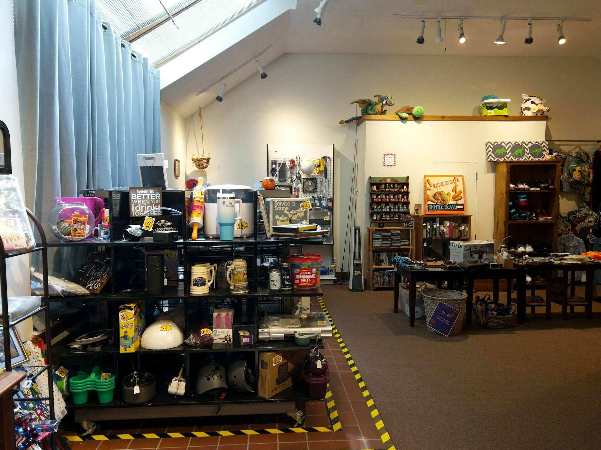 The Funky Flea interior with shelves of vintage goods, toys, games, and collectibles